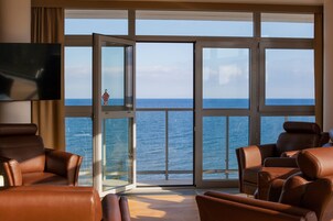 Executive Apartment, Sea View | Living area | TV