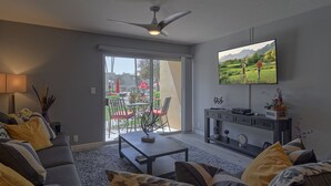 A modern living room with a sofa, coffee table, and TV. - Amazing 2Bd/2Ba Scottsdale Condo directly across street from Fashion Square  (Scottsdale)