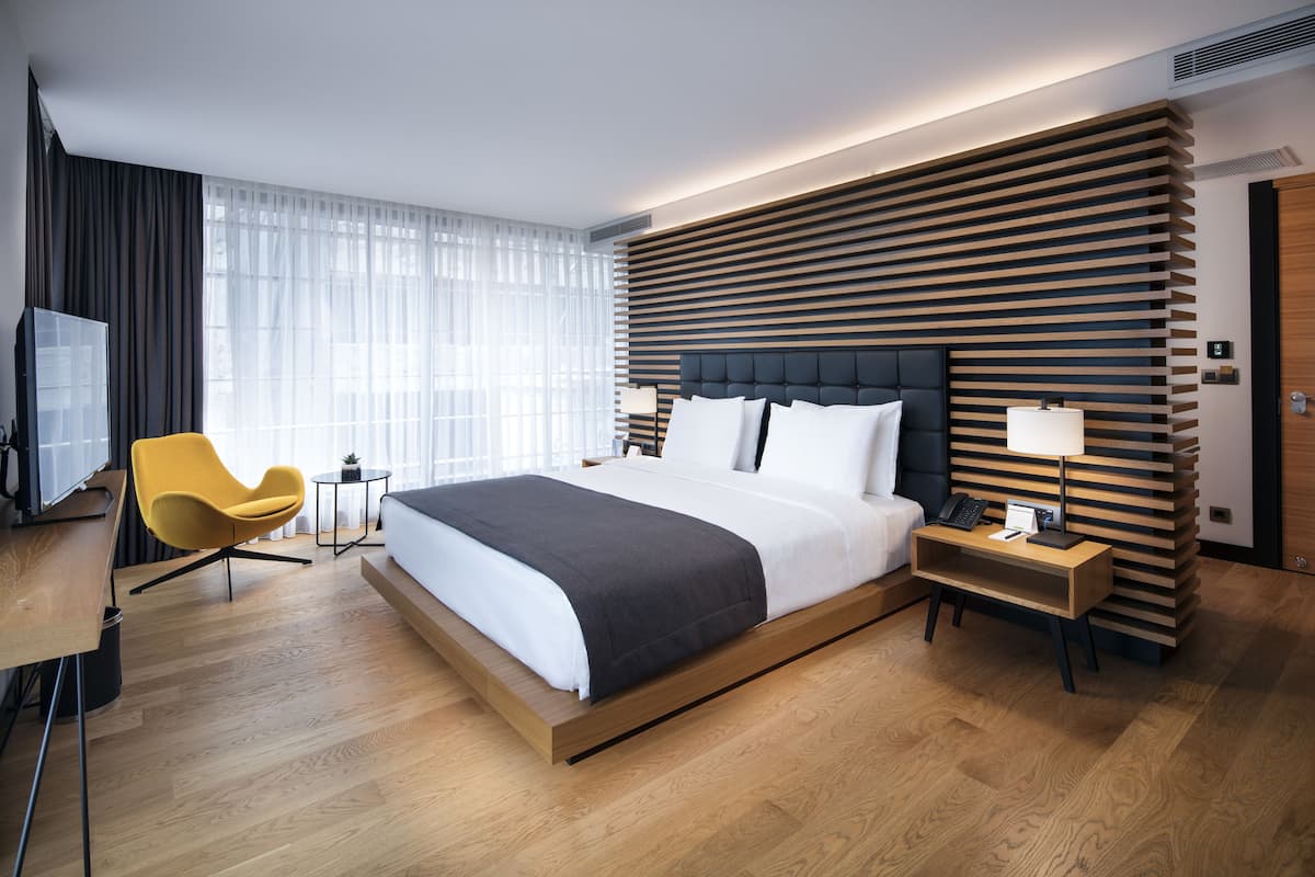 Superior Room | Minibar, in-room safe, desk, laptop workspace