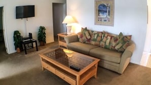 Appartement, plusieurs chambres | Aire de séjour