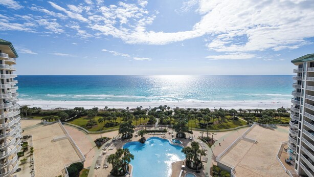 A resort with a swimming pool, beach, and ocean view. - Hardwood flooring throughout updated, tropical condo! 🌺 (Destin)