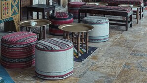 A traditional interior with stone walls, wooden furniture, and patterned textiles. - Hayat Zaman Hotel & Resort (At-Taybeh)