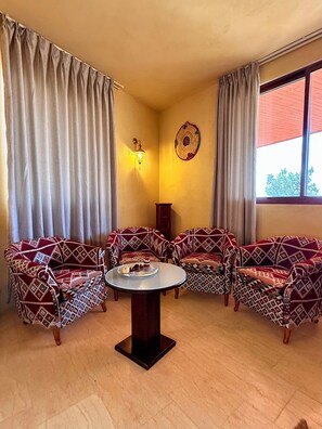 JST- Junior Suite | Living area | Flat-screen TV, pay movies, music library