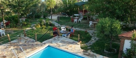 Seasonal outdoor pool, pool umbrellas, pool loungers