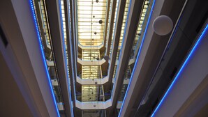 A multi-level atrium with glass railings and blue LED lighting. - Igneada Resort Hotel & Spa  (Demirköy)