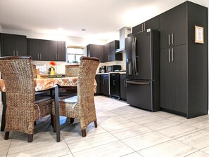 Fridge, microwave, stovetop, coffee/tea maker