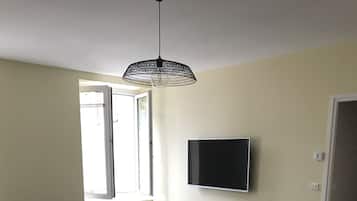 Family Apartment | Living area | 0-inch flat-screen TV with digital channels, TV