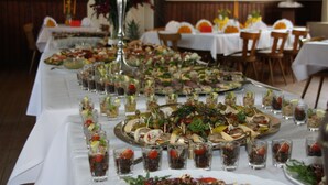 A long table with various food items and drinks, likely set up for a buffet or event. - Misselhorner Hof (Südheide)