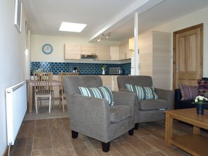 Apartment, 2 Bedrooms, Garden View (Exquisite Apartment) | Living area | 55-inch flat-screen TV with satellite channels, TV, DVD player - Seaside holiday Apartments (Rush)