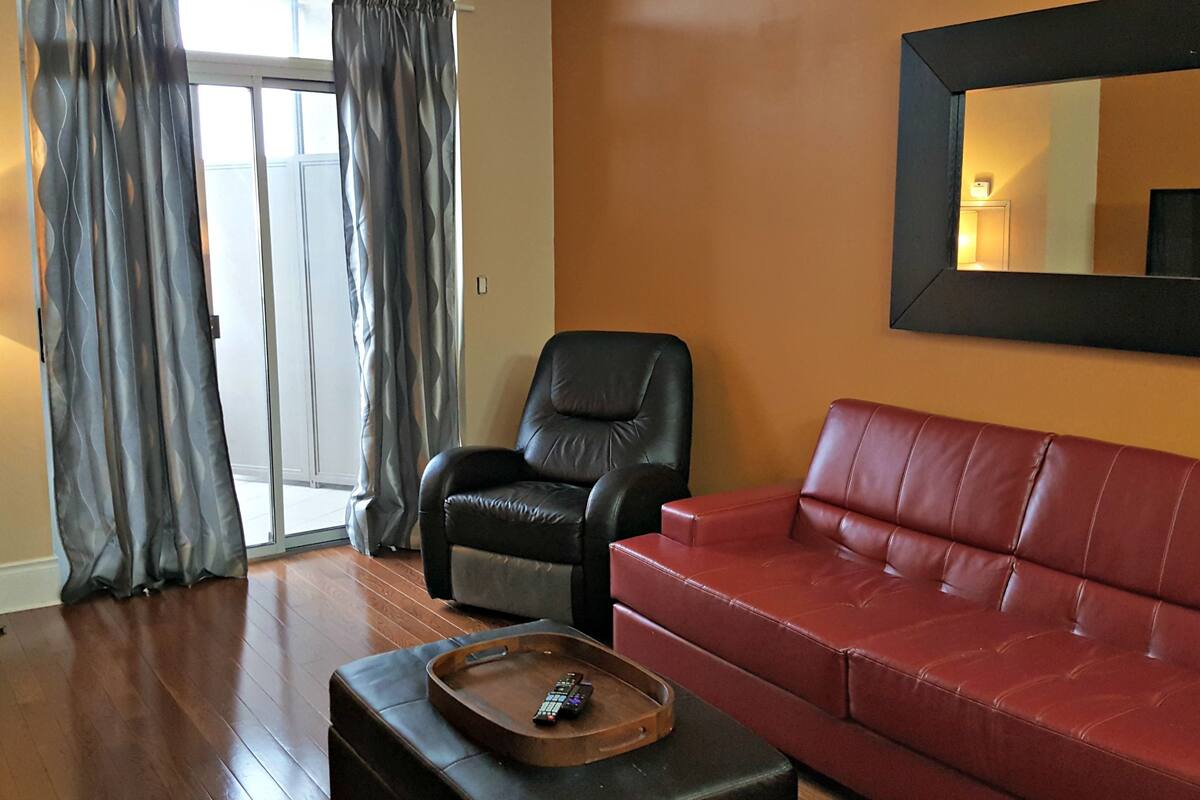 Signature Suite, 2 Bedrooms | Living room | Flat-screen TV, Netflix