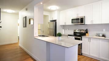 Suite, 2 Bedrooms | Private kitchen | Full-size fridge, microwave, oven, stovetop