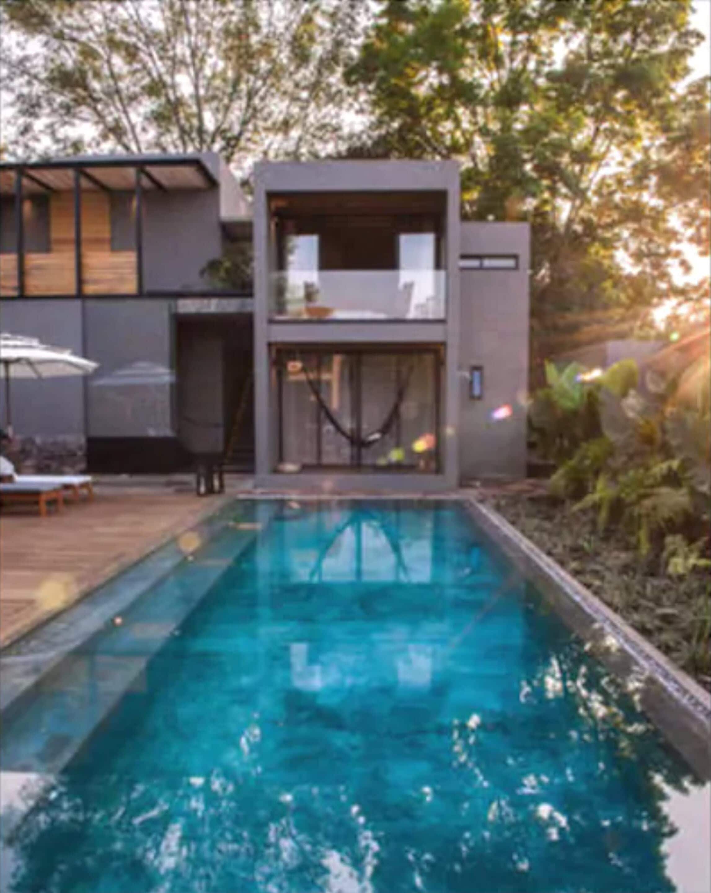 Outdoor pool, open 9 AM to 10:00 PM, pool umbrellas, sun loungers