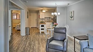 A compact living space with a dining area, kitchen, and seating area. - Hilton Head Condo w/ Pool Bar: Walk to Beach! (Hilton Head Island)