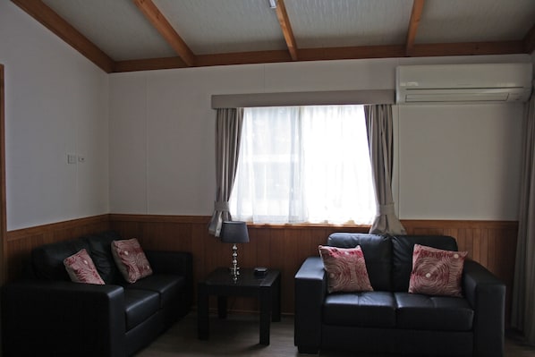 2 Bedrooms Musk Duck Bunk Cabin | Living room | Flat-screen TV