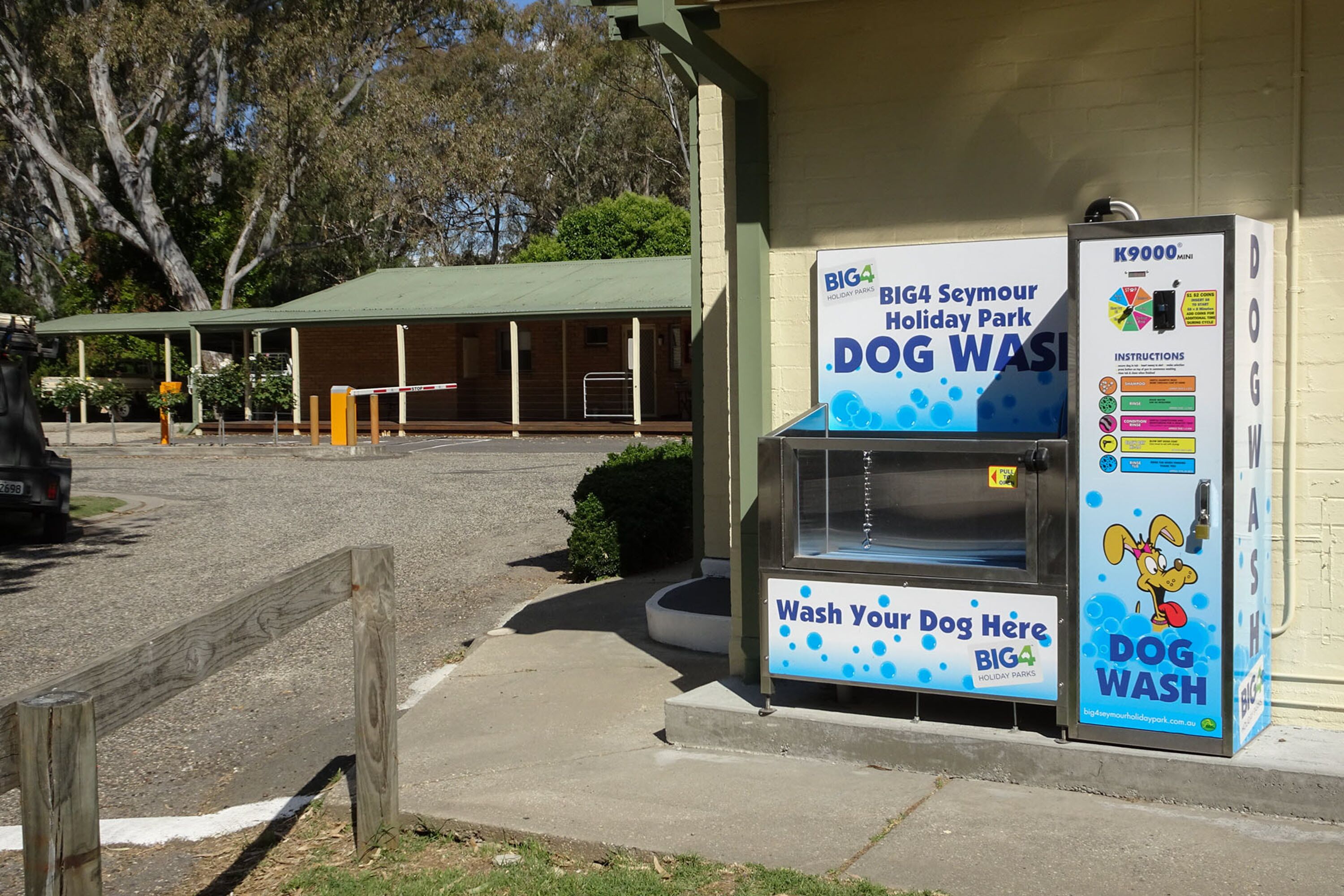 A dog wash station at Big4 Seymour Holiday Park with a sign and a K9000 machine.