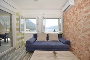 Apartment, 1 Bedroom, Terrace, Sea View | Living area | Flat-screen TV