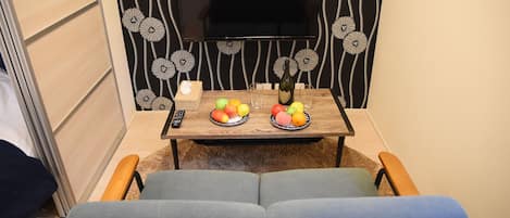 Habitación estándar, para no fumadores (202) | Sala de estar | Televisión de pantalla plana