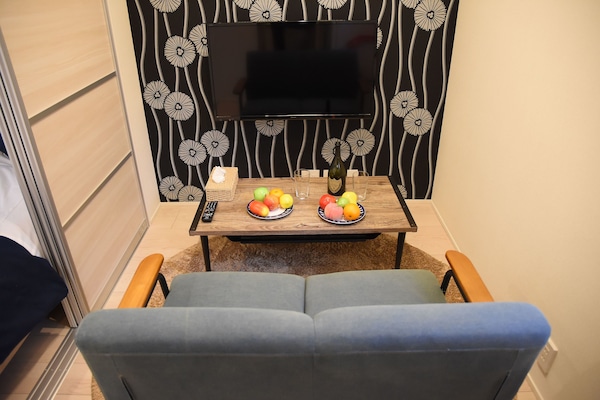 Quarto standard, para não fumantes (202) | Sala de estar | TV de tela plana