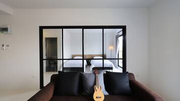 Family Twin Room with Balcony | Living room | 32-inch LED TV with cable channels, TV