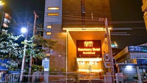 A multi-story hotel with a prominent entrance and a sign reading "Sanctuary Hotel Mandalay". - Sanctuary Hotel (Mandalay)
