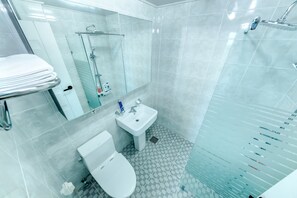 Standard Double Room | Bathroom | Shower, hair dryer, slippers, towels