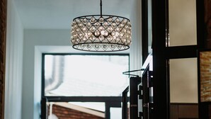 A chandelier with a geometric design hanging from the ceiling.