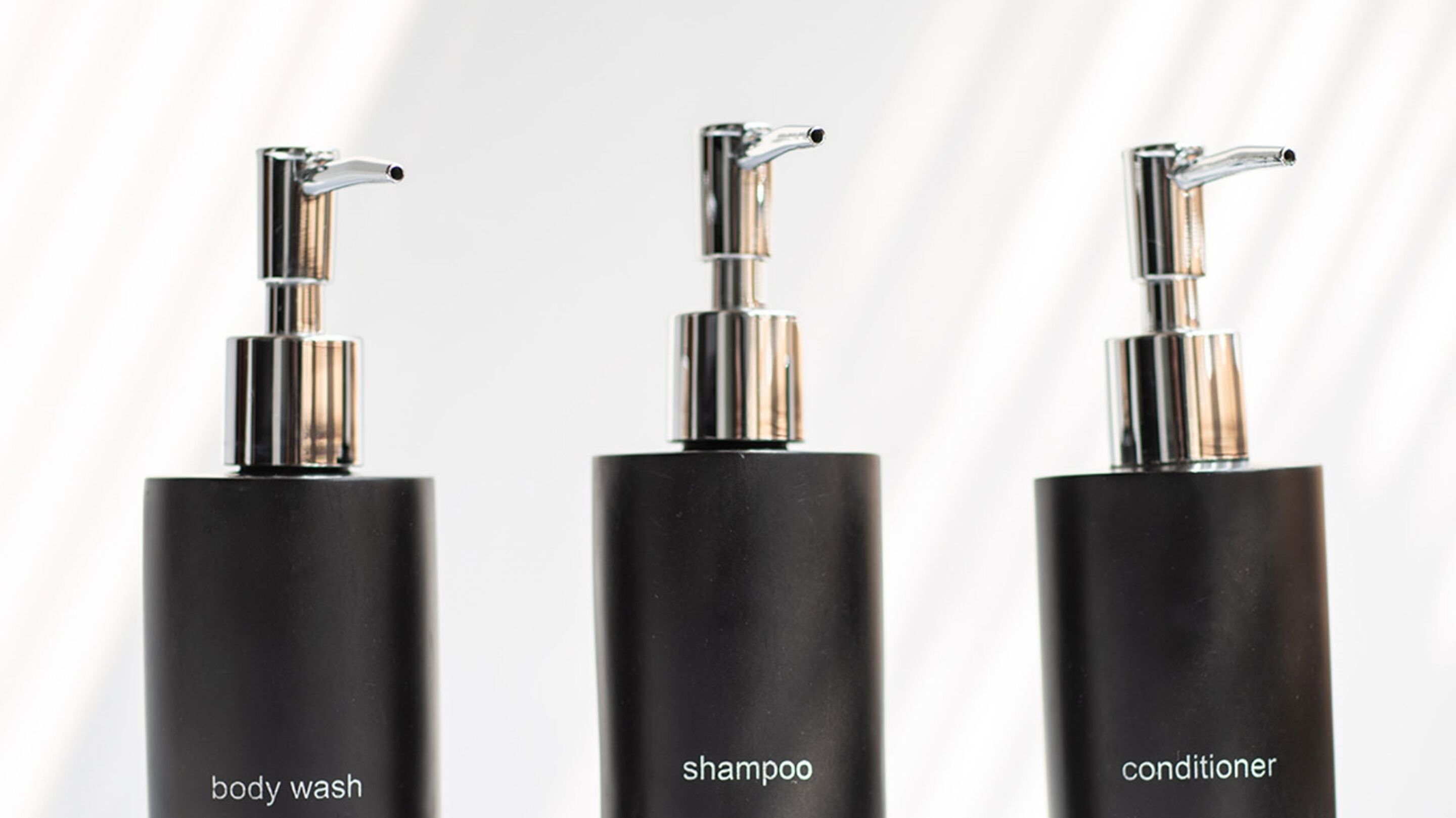 designer toiletries, hair dryer, bathrobes, slippers