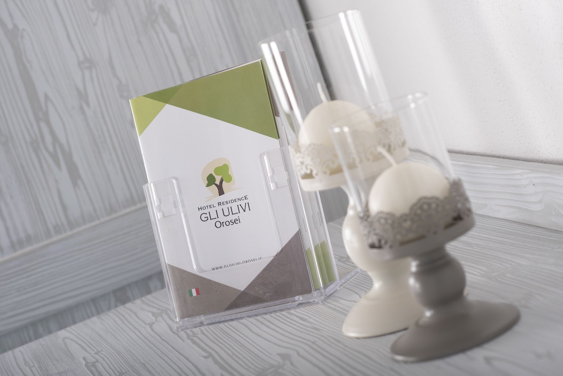 A hotel brochure titled "HOTEL RESIDENCE GLI ULIVI Orosei" with a website URL.