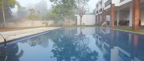 Outdoor pool, open 6:00 AM to 10:30 PM, pool umbrellas, sun loungers