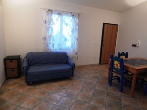 Apartment, 2 Bedrooms | Living area | TV - AffittaSardegna - Trilo Bianca 2 (Badesi)