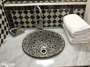 Shower, rainfall showerhead, designer toiletries, hair dryer