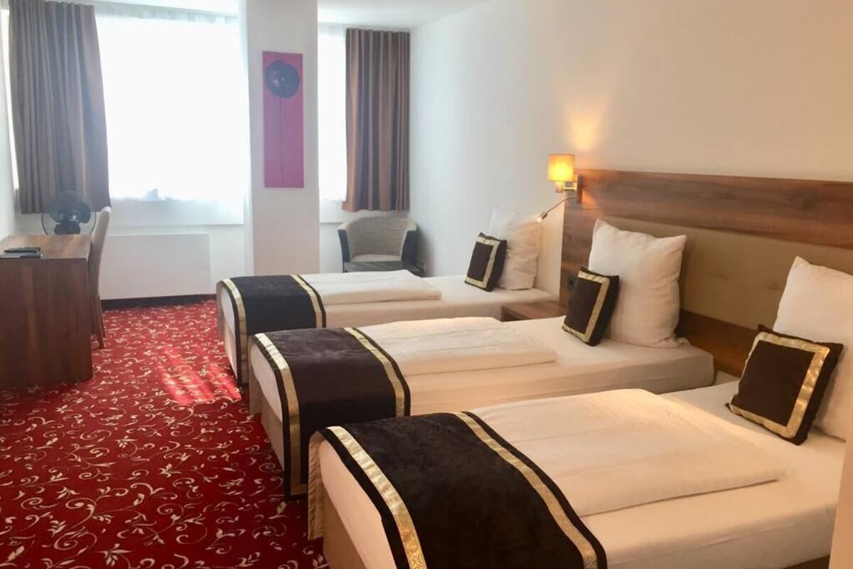 standard quadruple room | premium bedding, minibar, in-room safe, desk