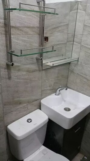 Shower, free toiletries, hair dryer, slippers