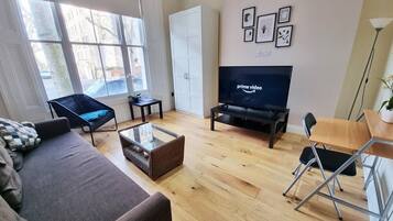 Deluxe Apartment, 1 Bedroom, Terrace | Laptop workspace, iron/ironing board, cots/infant beds, free WiFi