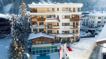 Experience the charm of the Zillertalerhof, a traditional Alpine hotel with a spacious balcony overlooking the surrounding mountains.