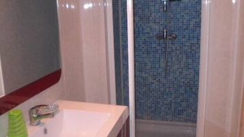 Shower, hair dryer, towels, toilet paper