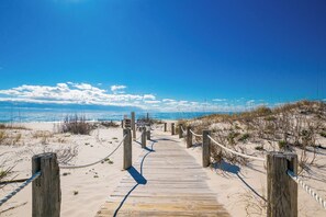 A wooden boardwalk leading to a beach with clear skies and distant ocean views. - Gulf Shores PLANTATION WEST! 2 BR 2 BA ~ Great Rates! (Gulf Shores)