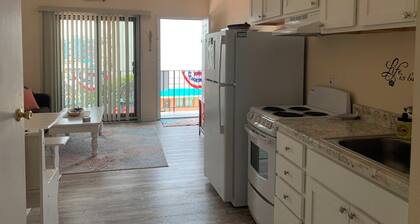 Comfy condo 1 block to beach and boards. Perfect for your family beach vacation!