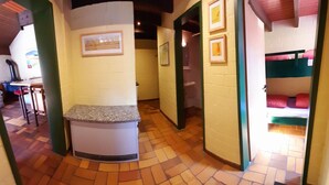 A narrow hallway with a kitchenette area, a sink, and a small window. - Typ Biberbau - Three Bedroom Resort, Sleeps 6 (Bestwig)