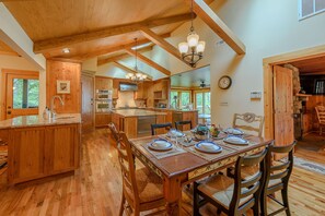 Enjoy cooking in this well-equipped kitchen with an oven, microwave, and range hood.