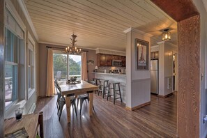 Enjoy a homey atmosphere with a modern kitchen, dining area, and large window.