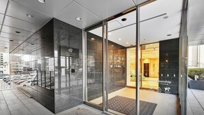 A Daiwa Roynet Hotel entrance with a glass door, a signboard, and a view of the interior. - DEL style NAGOYA-NAYABASHI by Daiwa Roynet Hotel (Nagoya)