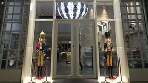 The exterior of a hotel named "MINI HOTELS" with a modern facade and a spherical decorative element above the entrance. - Mini Hotels Taichung Station Branch (Taichung)