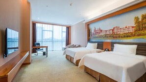 A hotel room with two beds, a desk, a television, and a large window. - Vienna Hotel (Guangzhou)