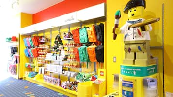 A LEGO store with colorful merchandise and a Build-A-Minifigure display.