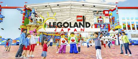 A LEGO-themed area with a sign reading "LEGOLAND JAPAN" and a brick-patterned floor.