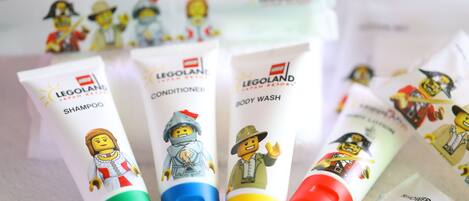 Several tubes of Legoland body wash and conditioner with cartoon characters on them.