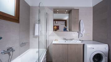 Combined shower/tub, hair dryer, towels, soap
