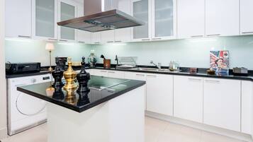 Fridge, microwave, stovetop, coffee/tea maker