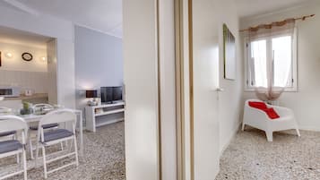 Apartment, 1 Bedroom | Living area | Flat-screen TV